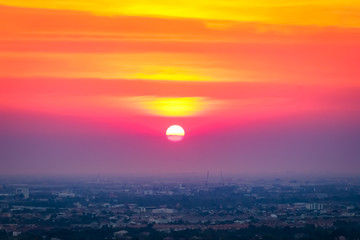 Sunrise sunset in the city with selective focus on the sun