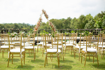 Beautiful and rustic garden wedding setup on a sunny day during summer.