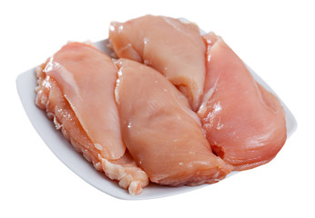 Raw chicken breasts and spices