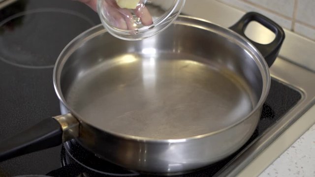 Pouring butter into the hot pan