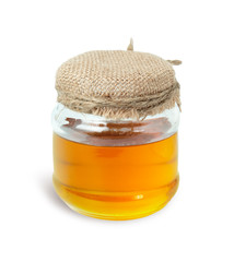 Honey in glass bottles cover the lid with hemp cloth isolated on white background