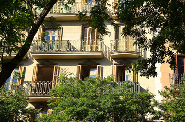 Fototapeta na wymiar Traditional Facade with Balconies in a Modernist House in Barcelona, Spain