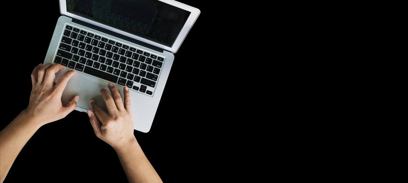man hand using computer on black background