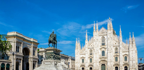 Milan Cathedral (Duomo di Milano) and Vittorio Emanuele II equestrian statue at Cathedral square of Milan, Lombardy, Italy. Famous tourist attraction of Milan, Italy.