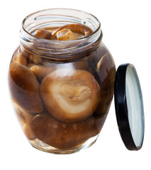 Open glass jar with natural shiitake mushrooms