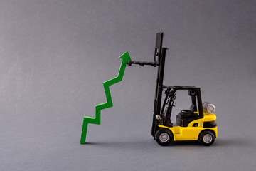 Photo of professional electric loader vehicle deliver service move store mall market supply sales growing rising arrow pointing up isolated over dark pastel grey color background