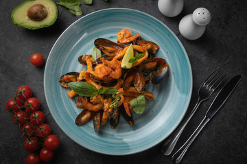 Seafood salad on a dark background
