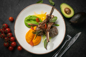 Grilled meat on a white plate in a top restaurant