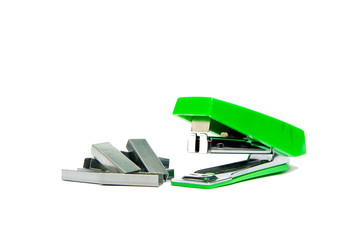 green stapler and staples