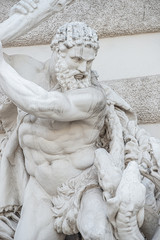 Naklejka premium Statue of fight of Hercules with a club and Hydra, serpent like water monster from Classical Greek Mythology, Hofburg Palace, outdoor, Vienna, Austria, details, closeup