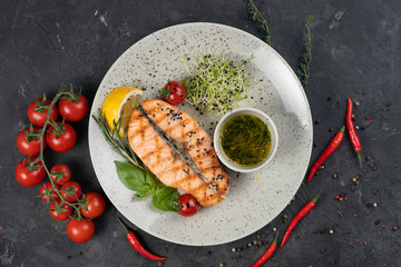 Fish grill on white plate in restaurant
