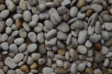 Fototapeta na wymiar boulder pebble beach Stones background Seamless Tileable Texture