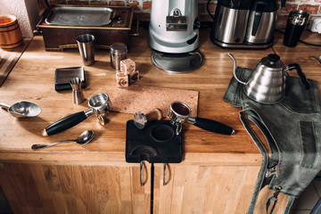 Accessories and items for coffee on a wooden table. School barista. Equipment for cafes.