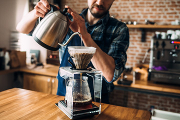 Man prepares coffee in style 