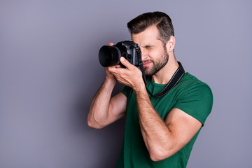 Profile side photo of concentrated paparazzi man have summer free time weekend shooting picture use...
