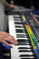 the piano on stage in the spotlight.