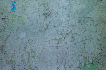 Old painted wall with cracked paint