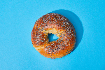 top view of fresh baked bun on blue background