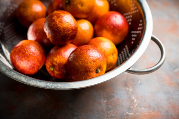 Ripe bloody oranges on the rustic background. Selective focus. Shallow depth of field.