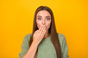 Portrait of shocked girl share secret she promise her friend dont say hide cover close lips hand palm wear style stylish trendy sweater isolated over bright shine color background