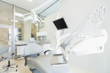 High tech orthodontist room with white furniture and modern tools