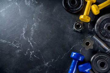 Sport and fitness background with dumbbells