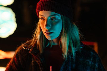 Beautiful young blonde girl wearing autumn clothes