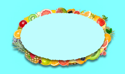 Creative photo of many different exotic tropical bright fruits with shadows on a blue background and an paper oval with beautiful jagged edges in the center for text. Bright summer pattern.