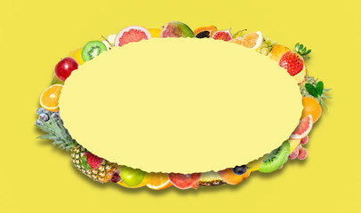 Creative photo of many different exotic tropical bright fruits with shadows on a yellow background and an paper oval with beautiful jagged edges in the center for text. Bright summer fruit pattern.