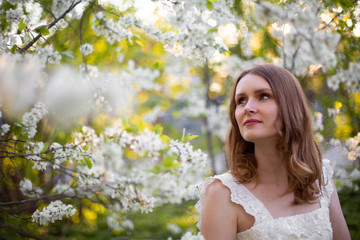 Fototapeta premium adorable, alone, attractive, beautiful, beauty, blonde, blooming, blossom, branch, bride, care, cherry, close-up, european, eyes, face, fashion, fashionable, female, femininity, flower, fresh, garden,