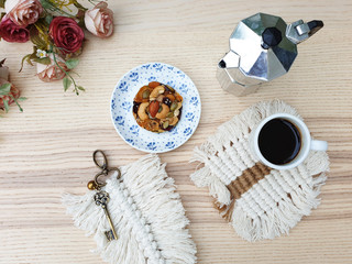 Cookies with nuts Almonds, Pumpkin seeds, Melon seeds, Cashews, Dried Raisins ,Sunflower Seed,Cranberry,white and black sesame in dish on Brown wooden table.with black coffee in cup,moka pot,fmacrame 