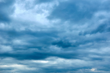 Dark blue gloomy, formidable sky in the clouds.