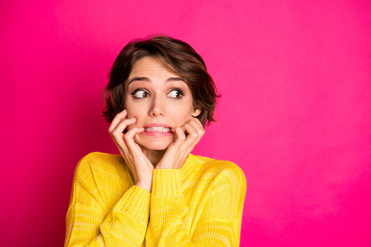 Portrait of frustrated anxious afraid girl look copyspace see she made horrible mistake bite finger nails wear sweater isolated over bright color background
