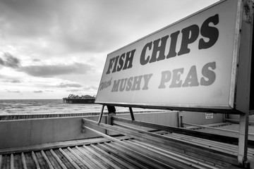 sign at brighton pier for fish and chips