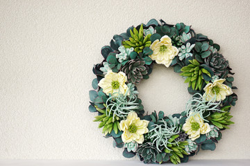  A beautiful flower wreath made of succulents on a white background