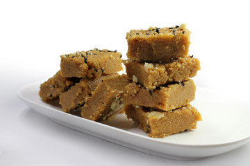 Sukhadi or Gor Papdi is Indian Traditional sweet made with wheat flour,desi ghee,jaggeery and nuts.very healthy Gujarati Mithai