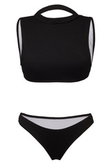 Detailed shot of a black two-piece swimsuit consists of a sport bra with neck strap and simple bikini. The fashion swimming suit is isolated on the white background.