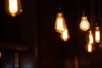 
Edison light bulb. A lot of light bulbs on a black background in a dark room.
abstract background...