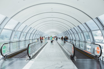 long horizontal escalator at international airport terminal