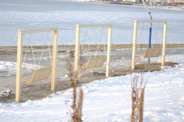 Shops - a swing on the seashore.