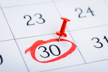 2020 calendar page marked with an important date in red pin. timeline, time, concept, idea,...