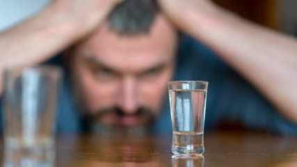 blurred portrait of drunk man in depression alcohol addiction