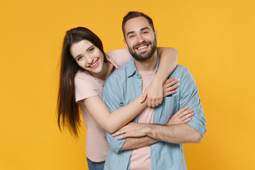 Cheerful laughing young couple two friends guy girl in pastel blue casual clothes isolated on...