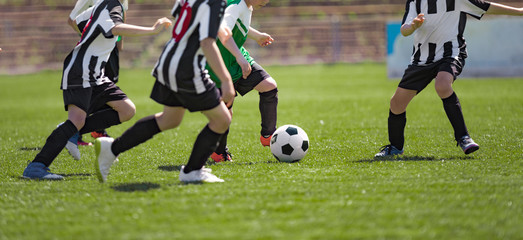 Kids Play Soccer Game. Children Outdoor Football Tournament Match on Grass Field