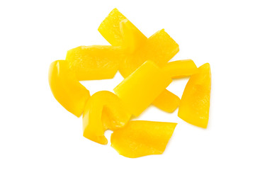 cut slices of yellow sweet bell pepper isolated on white background. top view