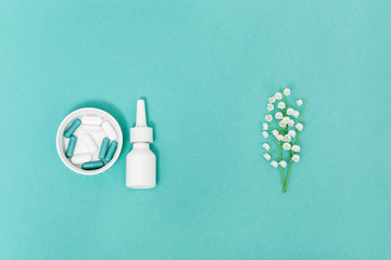 Allergy concept. Nose spray and tablets and capsules against allergies to pollen of flowering...