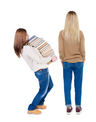 Back view of two woman in sweater.