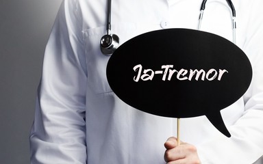 Ja-Tremor. Arzt mit Stethoskop hält Sprechblase in Hand. Text steht im Schild. Gesundheitswesen,...