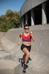 Woman doing sports, running outdoors