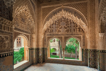 Beautiful arches, reliefs and tiles in arabic style, medieval interiors of the 14th century...